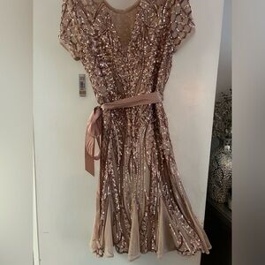 Beautiful caramel color sequin dress with flare bottom knee length